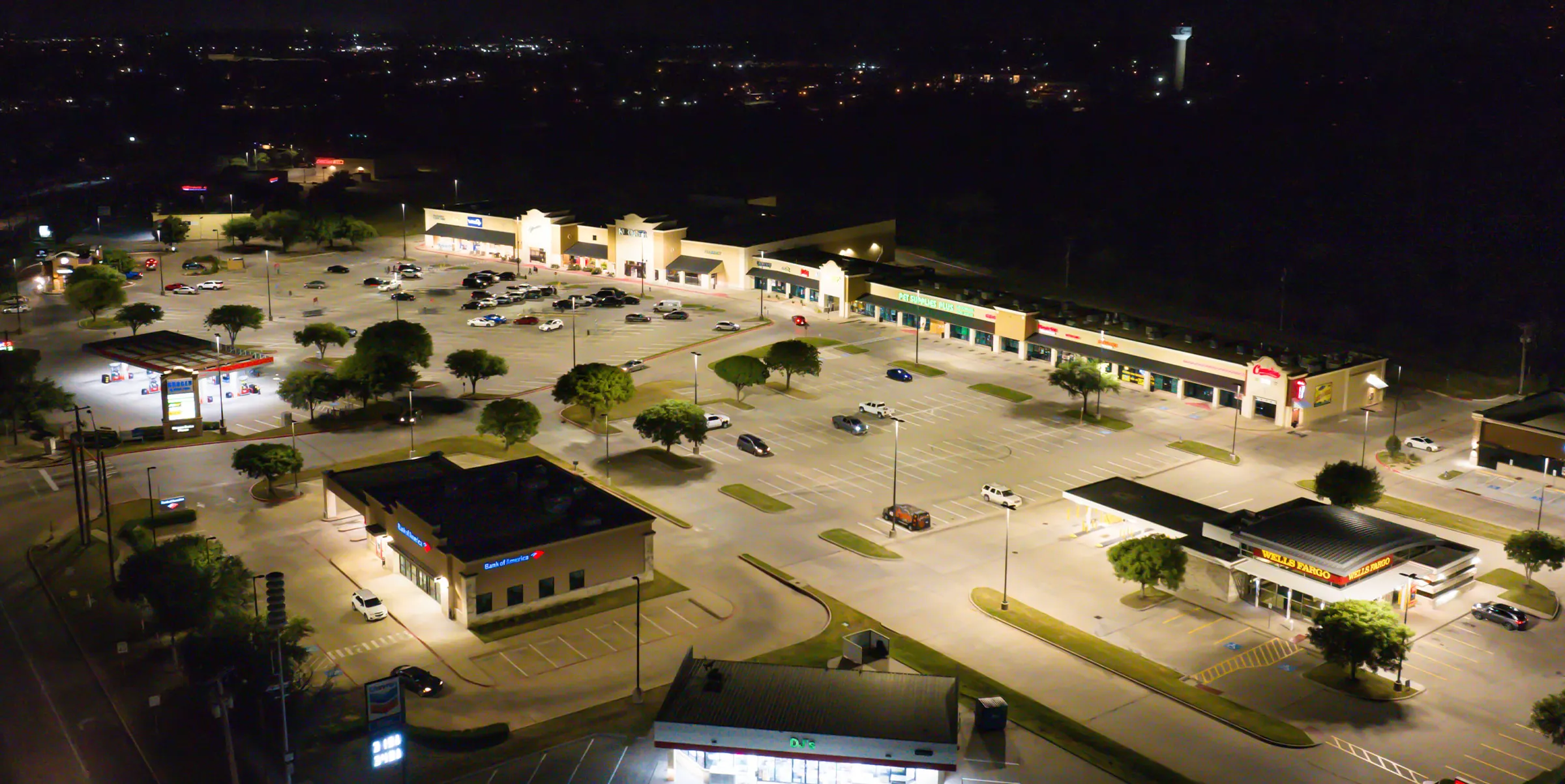 Aerial night view of Stone Gate Plaza lit by LED lighting